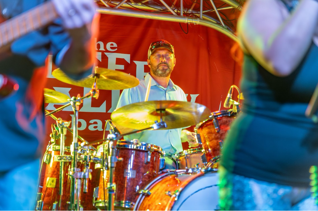 Photo of Trey Walker at his drumkit.